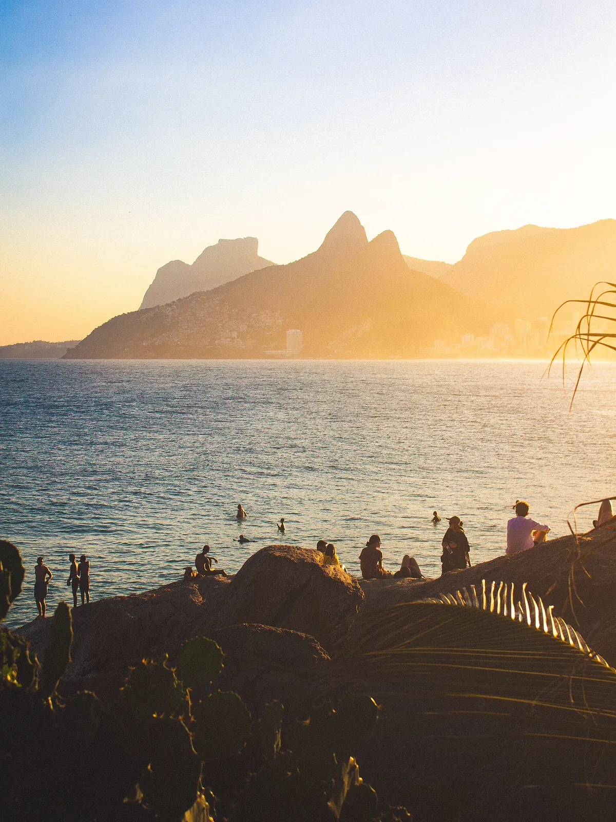Sunset over Ipanema and Dois Irm&atilde;os from the Arpoador rocks
