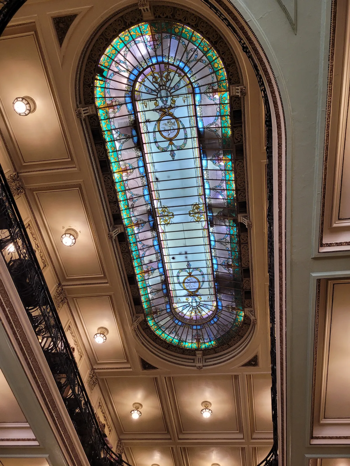 The stained-glass skylight and mirrored galleries inside the Confeitaria Colombo