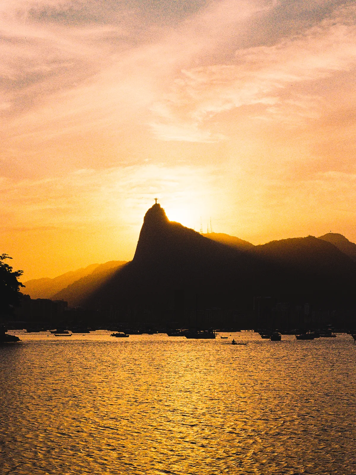 Sunset over Guanabara Bay from the Mureta da Urca, Christ the Redeemer on the skyline